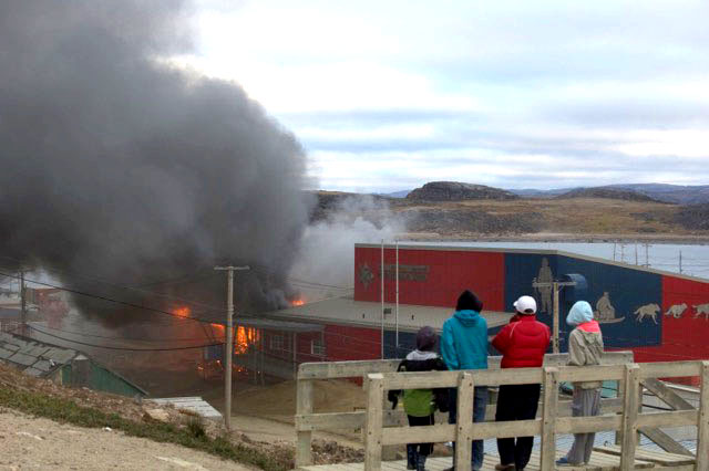 The fire at the Peter Pitseolak high school last year contributed to the high cost of fire damage in Nunavut in 2015. (PHOTO BY JOHN CORKETT)