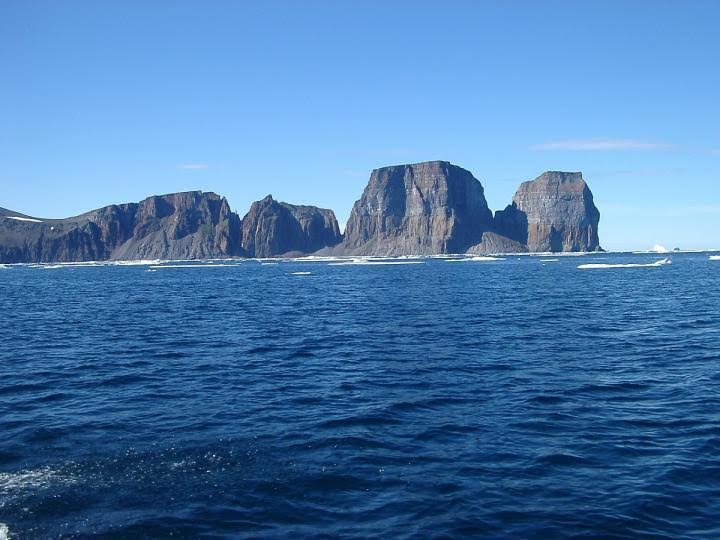 Basalt cliffs around the shoreline of Baffin Island contain lava which is 4.5 billion years old, a research team has determined. These rock formations are called flood basalts because they were created by massive eruptions of lava. The solidified lava itself is only between 60 and 120 million years old, depending on its location. But the team, whose research has been published in the journal Science, discovered that the molten material from inside the Earth that erupted to create these plains of basaltic rock is 4.5 billion years old. (PHOTO COURTESY OF DON FRANCIS/MCGILL UNIVERSITY)