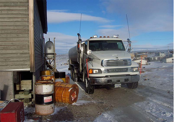 A water truck is pictured here servicing a home in Naujaat. Nunavut health officials are asking residents of the Kivalliq community of 950 to conserve water this week after the hamlet’s sewage truck broke down. Until the truck is back on the roads, the health department said July 7 that households should limit their water use to essential purposes, like drinking, bathing and cooking. The Naujaat health centre will be closed, except for emergencies, until the sewage truck is operational again. (PHOTO COURTESY OF THE HAMLET OF NAUJAAT)
