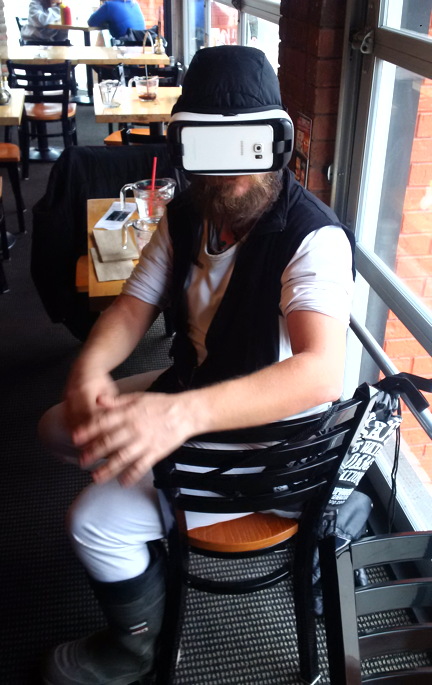 Polarman tries on a pair of virtual reality glasses in Toronto which blow his mind. Polarman, aka Derek Emmons, is collaborating with Pinnguaq to create a short, animated virtual reality film about the life of Iqaluit's homegrown superhero. (PHOTO BY RYAN OLIVER)