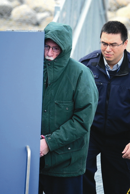 Eric Dejaeger is lead into the Nunavut Court of Justice during previous court proceedings in Iqaluit. He is currently appealing some of his sex crime convictions but Nunavut's legal aid society has turned down his request for a lawyer. (FILE PHOTO)