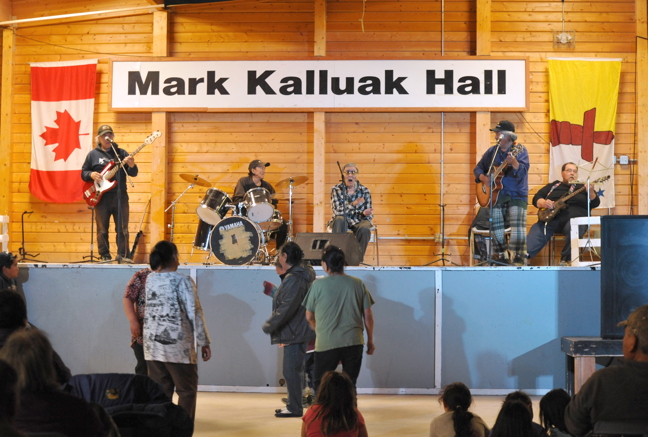 Despite being frail and weak from Parkinson's Disease, Nunavut living legend Charlie Panigoniak managed to get on stage with his old mates from the Kapurvik Band and perform before a packed audience during a concert held in his honour in Arviat Aug. 30. The show, organized by the Arviat Music Festival Society, included many local musicians covering Panigoniak's songs which, according to local reports, brought Panigoniak to tears as he sat in the audience with his wife Lorna. Peter Shamee entertained the crowd by simulating what Panigoniak used to do during performances including inviting a non-Inuk to the stage to try to copy what he was singing in Inuktitut. Panigoniak, who is in a wheelchair, closed the show by performing the song 