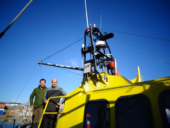 Northwest Passage sailors take a break in Cambridge Bay: David Scott Cowper, 74, seen here Sept. 8 with his son Fred, 38, on board their bright-yellow 