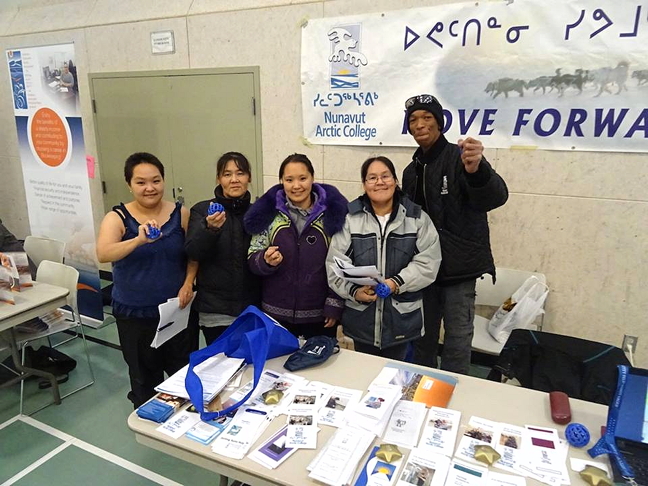 Nunavut Arctic College's booth at the Kitikmeot career fair has all the answers for success: Further your education—and if you get stressed, well, you can squeeze their stress-reducers. At least, that was among the suggestions from James Howard, NAC counsellor in Cambridge Bay, shown here with Marjorie Bunnik Kemaktun, Shelley Tologanak, Cassandra Tologanak and Beatrice Udlaoyak, at the NAC booth. Job-seekers and students turned out Sept. 15 for the fair which took place at the Kiliinik High School, after visits to Gjoa Haven, Taloyoak and Kugaaruk. The fair made its last stop in Kugluktuk Sept. 16. (PHOTO BY JANE GEORGE)