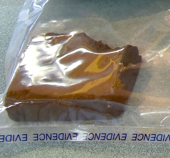 This closeup of a piece of hashish seized Oct. 12 in Iqaluit by the RCMP looks like it has a bite taken out of it. (HANDOUT PHOTO)