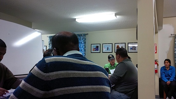 Harry Maksagak, centre in green, chairs the Cambridge Bay Housing Association, which met Sept. 30 to hear, among other things, from residents of the western Nunavut community on their housing-related concerns. (PHOTO BY JANE GEORGE)
