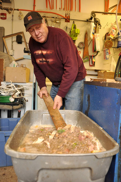 Preparing dog food: a mixture of ham, Arctic char and kibble. (PHOTO BY THOMAS ROHNER)