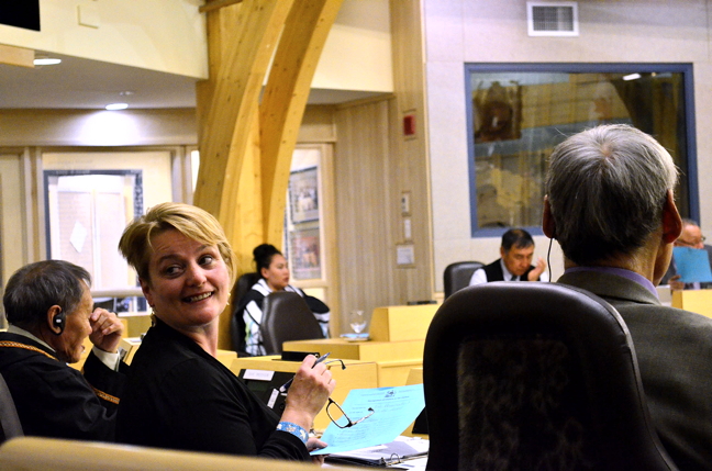 Iqaluit-Niaqunnguu MLA Pat Angnakak shares a smile with a visitor at the Nunavut Legislative Assembly last week. Angnakak has been asking cabinet members in the legislature for progress reports on a couple of bodies she wants to see established: a board of management for the Qikiqtani General Hospital and a public service commission, an independent body that manages government human resources and which MLAs voted for unanimously during the spring sitting. Now into their third week of the fall sitting, Nunavut MLAs and ministers have sparred over a range of issues from family service interventions to caribou quotas and Inuit language rights. Scroll through our main page and news page to see what you've missed. This session is expected to wrap up on Nov. 7. (PHOTO BY JIM BELL)