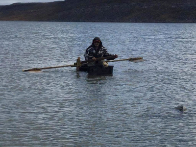  This photo shows Nungaq paddling away from Frazier Island on the raft he made from plastic containers. This was the last time his hunting companions saw the man. (PHOTO BY STEPHAN MINA)
