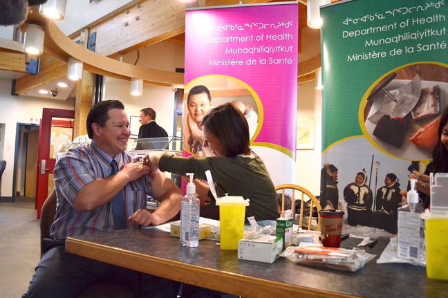 Nunavut's health minister George Hickes gets his flu shot in Iqaluit last month. The territorial health department plans to immunize all students from Grade 6 to Grade 9 against whooping cough by the end of the year. (FILE PHOTO)
