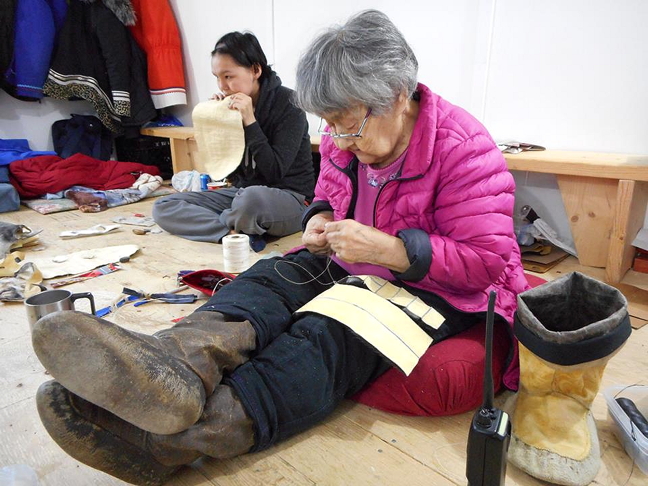 Elder Igah Palluq leads a kamik-making workshop offered by the Ilisaqsivik Society. The 30-day workshop, which began a few weeks ago, is organized by the society's elders committee and is one of their most popular programs. Ilisaqsivik is a non-profit Inuit-run organization in Clyde River that runs a variety of programs for all members of society from new moms to children, youth, men, women and elders. If you live in Clyde River, contact them to see what programs might interest you. (PHOTO COURTESY ILISAQSIVIK SOCIETY)