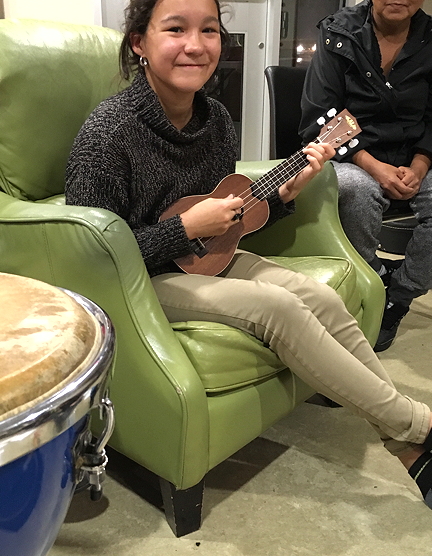 Christine Agnetsiak, 13, originally from Pond Inlet, picks up the ukulele for the first time Oct. 20. By the end of the night she could play a whole song. 