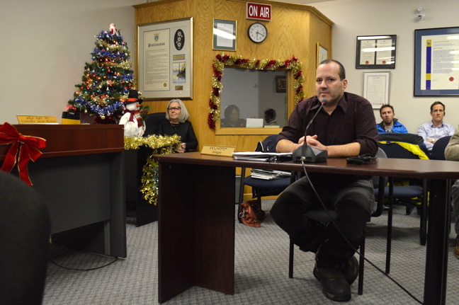 Stephen Hooey, chief operating officer for the Iqaluit Housing Authority, wheeling and dealing with Iqaluit City Council Dec. 14 to rid housing authority units of abandoned vehicles. (PHOTO BY STEVE DUCHARME)