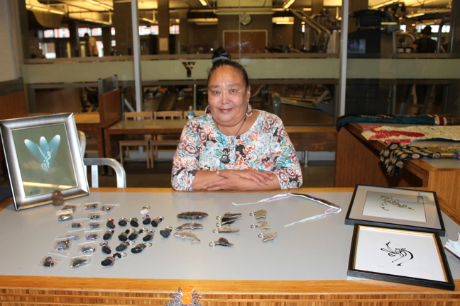Okeejuasee Sageatook shows off some lucky sealskin keychains and other items she had for sale at a recent arts and crafts fair in Ottawa organized by Tungasuvvingat Inuit. (PHOTO BY KELLY BUELL)