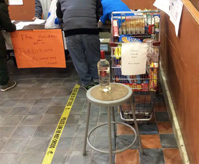 This is what $300 will buy you in the Nunavik community of Puvirnituq: a cart full of groceries, or a bootlegged 40-ounce bottle of vodka. (PHOTO COURTESY OF INUULITSIVIK) 