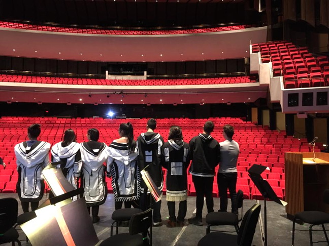 Pretty soon, all those seats will be filled with people. A group of eight first- and second-year Nunavut Sivuniksavut students at the Ottawa-based college stands on stage at the Centennial Concert Hall in Winnipeg, Man., before performing at the Dec. 8 2016 Arctic Inspiration Prize gala ceremony. 