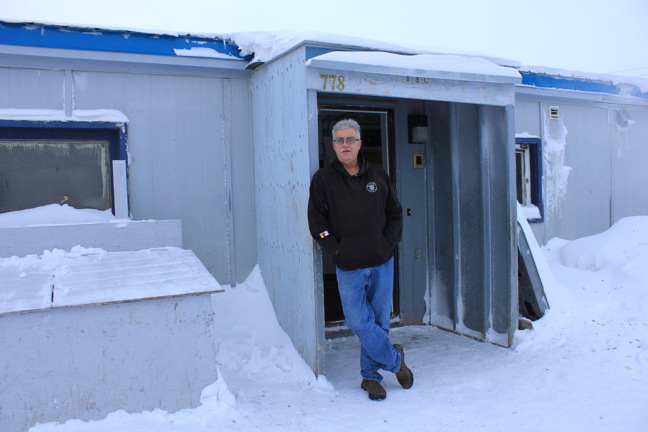 Doug Cox stands in front of the Iqaluit men's shelter on Fred Coman Drive for which the shelter's non-profit society pays about $100,000 in rent annually. (PHOTOS BY LISA GREGOIRE)