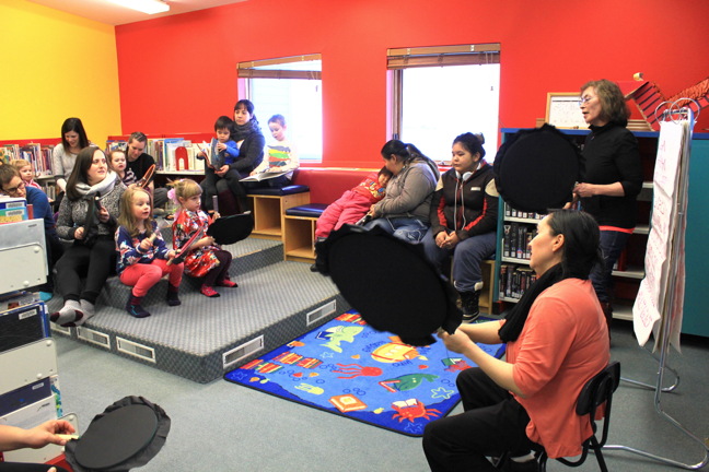 Mary Flaherty, in black, and Elisapee Flaherty, in orange, lead a drumming workshop at the Iqaluit Centennial Library Jan. 14 with some enthusiastic young drummers. The Friends of the Iqaluit Library sponsors weekly events every Saturday afternoon including one monthly event in French. Contact the library at 975-5595 for more information. (PHOTO BY LISA GREGOIRE)