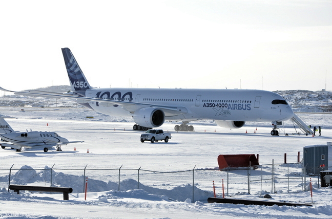 An Airbus A350-1000 sits on the tarmac at the Iqaluit airport Feb. 21. A Tweet from the French aircraft company said it was kicking off a series of cold-weather tests in Nunavut's capital, appropriate since it's been hovering around -30 C all week. 