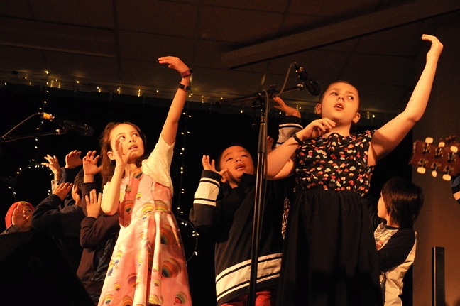 Young performers from Ecole des Trois-Soleils regale family and friends at Inuksuk High School in Iqaluit with a story-song about a hot air balloon adventure Feb. 5. The performance was part of a weekend-filled concert series organized by the Iqaluit Action Lab using money they received from the Canada 150 Project. Alianait Arts Festival put on the Midwinter Concert Series, hiring more than 30 Nunavut-based musicians to perform over three days. (PHOTO BY THOMAS ROHNER)