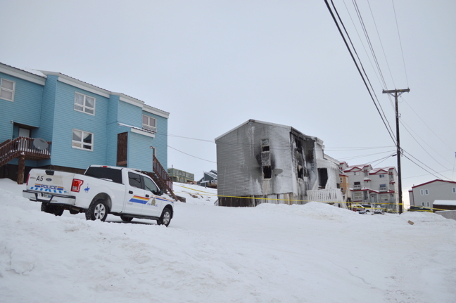 Iqaluit firefighters spent more than three hours battling a fire at a public housing unit on Siku Crescent Feb. 19. (PHOTOS BY STEVE DUCHARME)
