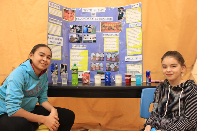Sonia Gordon and Betsy Angnatuk, Secondary 1.0 students of Kelsey Kearns at Jaanimmarik School in Kuujjuaq, show off the results of their tooth decay science project Feb. 1. The project, which looked at the impact of different substances on teeth, was part of the annual Expo Science Fair at the school, where students present projects in French and English and volunteer judges pick their winners. The top projects from this local fair will be entered into Nunavik's regional science fair, which takes place in Inukjuak Feb. 14 and Feb. 15. (PHOTO COURTESY PIERRE-LUC VAUDREUIL)
