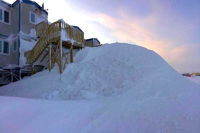 You could take the stairs or... you could ski to work. This is Coral Harbour, on the morning of March 10, after high winds and blowing snow this week made ski hills from some second storey steps. Some detached homes in the Southampton Island community of 890 were completely obscured by snow drifts. According to the Qulliq Energy Corp.'s Twitter feed, about 10 customers in Coral Harbour were without power March 8 and crews were on-site trying to fix the problem. The QEC later tweeted that crews were unable to make repairs due to