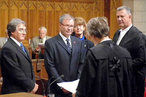 Dennis Patterson takes his oath of office in the Senate chamber on Sept. 15, 2009, as Senator Charlie Watt, Marjory LeBreton, then the Senate government leader, and Mark Audcent, a Senate law clerk, look on. At the time, Patterson promised he would quit in eight years, but the Senate reform package the promise was attached to was killed by the Supreme Court of Canada and Patterson now says he'll keep the job until he reaches age 75 in 2023. (PHOTO BY DENNIS DREVER)