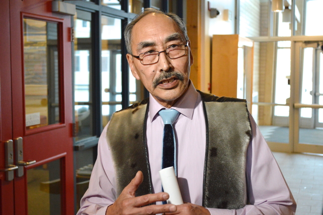 Nunavut’s Education minister Paul Quassa speaks to reporters at the Legislative Assembly March 7 after introducing Bill 37, a series of amendments to the Education Act. (PHOTO BY STEVE DUCHARME)