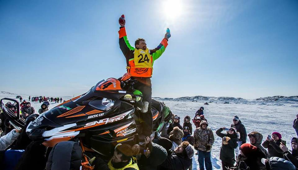 Bobby Gordon of Kuujjuaq celebrates his April 15 win in the Iqaluit to Kimmirut snowmobile race in this photo posted on the Iqaluit Public Service Facebook page. (PHOTO/FACEBOOK)