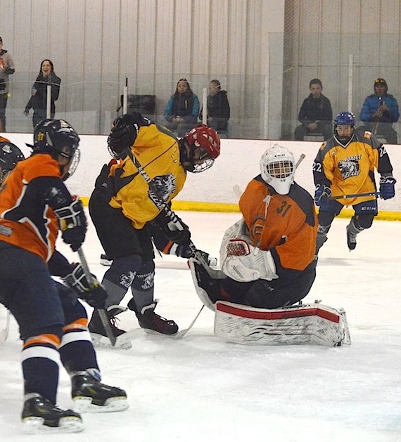Hockey teams from Iqaluit and Kuujjuaq play April 15 at the Arctic Winter Games arena, as part of a weekend-long tournament organized by the Iqaluit Amateur Hockey Association during Toonik Tyme. (PHOTO BY STEVE DUCHARME)
