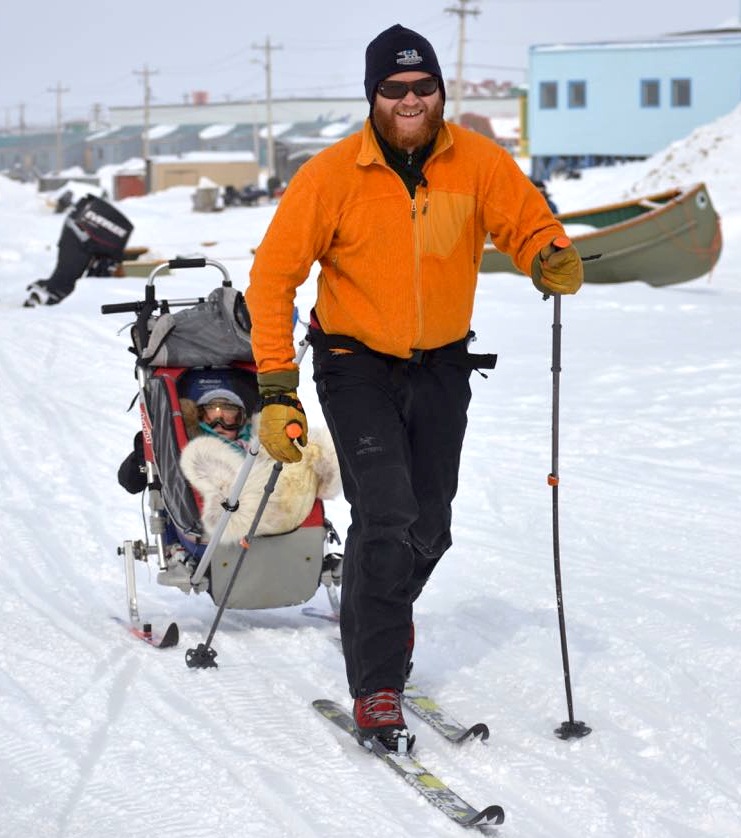 A participant in Toonik Tyme's April 14 loppet race heads off across the ice on cross-country skis, pulling a child in a sledge, (PHOTO BY STEVE DUCHARME)