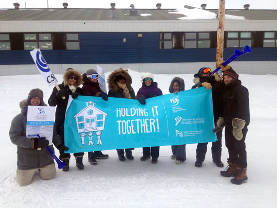 Quaqtaq teachers, professionals and support staff demonstrate outside the community's Isummasaqvik school April 26. They're asking the KSB to table its demands so their union can finalize their contract negotiations after two years of talks. (PHOTO COURTESY OF AENQ) 