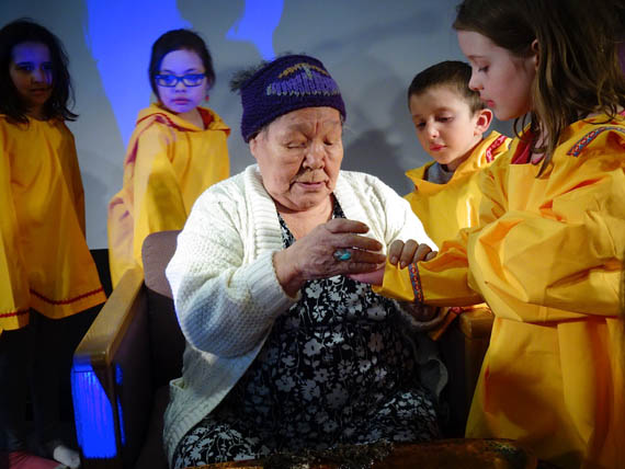 At Iqaluit's Ecole des Trois-Soleils' 15th anniversary as Nunavut's sole French-language school, elder Alacie Joamie helps students learn about lighting a qulliq. In front of an audience of roughly 140 parents and students, teacher Simon Houle spoke about the school's beginning—and its growth from  serving 35 students to nearly three times that many today. Paul Okalik, MLA for Iqaluit-Sinaa, and Nunavut's deputy minister of education, Kathy Okpik, also attended the event which included throat-singing from Marie Belleau and Celina Kalluk and a huge cake to share. See more photos on our Facebook page. And read more about the event on Nunatsiaqonline.ca. (PHOTO BY JANE GEORGE)