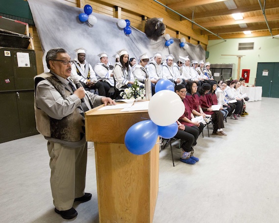 Graduation time in Cambridge Bay: Paul Emingak, the executive director of the Kitikmeot Inuit Association, speaks to students at Nunavut Arctic College during their April 25 graduation in Cambridge Bay. Social Services Worker students (certificate and diploma students) and the Environmental Technology Program diploma students sat on the stage in white, while on the floor you could find the Camp Cook students in red, who achieved records of achievement, Adult Basic Education students and College Foundation program graduates who received certificates. (SUBMITTED PHOTO) (SUBMITTED PHOTO)