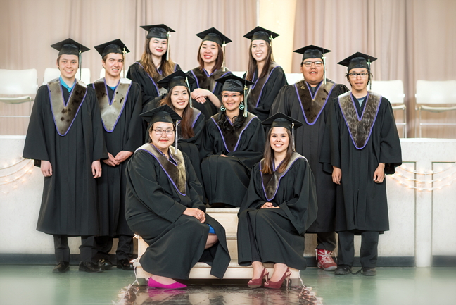 How's that for proud? Cambridge Bay's Kiilinik High School held its graduation ceremony May 27 to honour and celebrate a dozen graduates this year. Back row, from left: Gabriel Lafrance, Wade Moore, Zoe Ohokannoak, Pearlie-Mae Howard, Danielle Omilgoetok, Calvin Ehaloak and Leroy Kaosoni. Middle row, seated, from left: Dale Epilon and Harley Evalik-Greenley. Front row, seated, from left: Tobi Kingagolek and Alysha Wilson Maksagak. Congratulations from Nunatsiaq News! (PHOTO BY DENISE LEBLEU IMAGES)