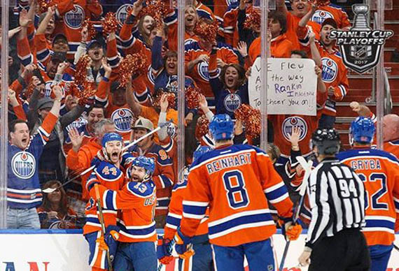 I spy some Nunavummiut: Edmonton Oilers celebrate their 7-1 victory over the Anaheim Ducks May 7, with the help of Nunavut fans in the crowd, whose sign says: 