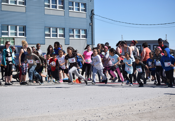 Runners sprint away from the starting line of a community marathon in Puvirnituq June 17. Inuulitisivik health centre organized the event called Arpangi-Let’s Run, hosting 21-kilometre, 10-kilometre, five-kilometre and a one-kilometre runs for participants with different fitness levels. Organizer Jessica Boudreau said 92 community members took part; 33 of them children. All the children who participated received medals, as well as the winners in the men’s and women’s categories. See more photos on our Facebook page. (PHOTO COURTESY OF J. BOUDREAU)