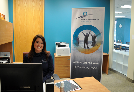Connie Qaunaq-Burke sits behind the desk at the Nunavik Sivunitsavut office space in Montreal, where she works as an administrative assistant. Qaunaq-Burke, originally from Arctic Bay, graduated from the Ottawa-based Nunavut Sivuniksavut in 2009. (PHOTO BY SARAH ROGERS) 