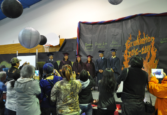 Proud parents gather around the stage to get photos of Kiluutaq school’s graduating class of 2016-17 following a May 31 ceremony in Umiujaq. (PHOTO BY SARAH ROGERS) 