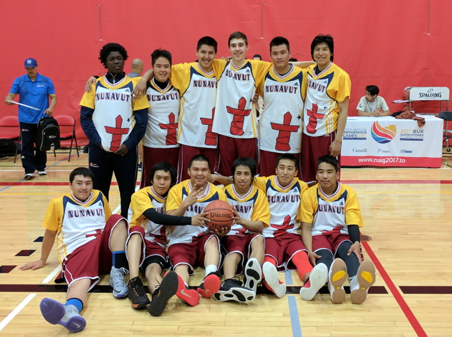 Team Nunavut's under-19 basketball team poses for a photo at the North American Indigenous Games, now on in Toronto. The basketball team finished third in their division in the round robin with two wins and two losses for a total of four points. This year, Nunavut sent four teams to the NAIG: two volleyball teams, one badminton team and the basketball players. Nunavut's mixed doubles badminton players faired well this year: Mike Kavik and Carla Kaayak play off against Davidee Kudluarok and Lucy Jo Appaqaq for third place today, July 21, at 12:30 p.m. (PHOTO COURTESY TEAM NUNAVUT)