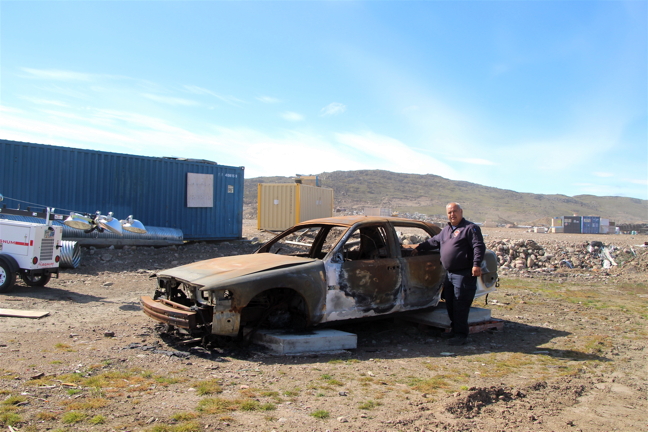 Iqaluit's deputy fire chief Stephane Dionne stands by a burned out car at the fire department’s training grounds down Federal Road. (PHOTOS BY BETH BROWN)