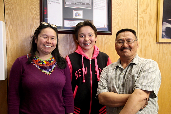 Iqaluit Mayor Madeleine Redfern, left, with 11-year-old Cassiar Cousins and recreation committee chair Coun. Joanasie Akumalik. Cousins attended a city council meeting, July 11, to ask the city to hire more lifeguards at the Aquatic Centre during peak times, so paying pass holders are not turned away. (PHOTO BY BETH BROWN)
