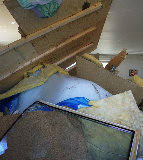 The floor of this house in Nuugaatsiaq is now punctured by an iceberg, leading the team of experts who recently visited the site of the June 18 tsunami to believe the house was torn off its foundation by the wall of water and then dropped down on the ice. (PHOTO BY HERMANN FRITZ)