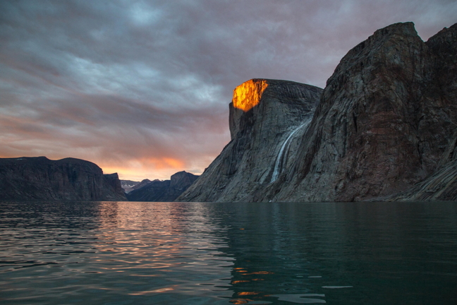Sunshine, on my shoulder, makes me happy: A shard of midnight sun alights on a mountain top in Clyde Inlet, about 50 km from Clyde River. The things you see when you're out hunting narwhal. (PHOTO BY ROBERT KAUTUK)