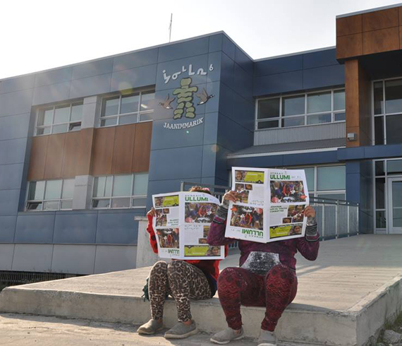 Kuujjuaq youth read a copy of Qarjuit’s new quarterly publication, Uvikkait Ullumi, which highlights youth achievement in Nunavik. (PHOTO COURTESY OF QARJUIT) 