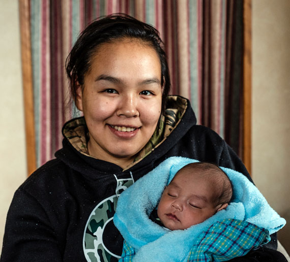 Asinnajaaq Ningiuk, 19, pictured here with her infant son Peter, was among dozens of young Nunavimmiut selected to take part in this year's Qanuilirpitaa Inuit health survey when it stopped in Inukjuak.