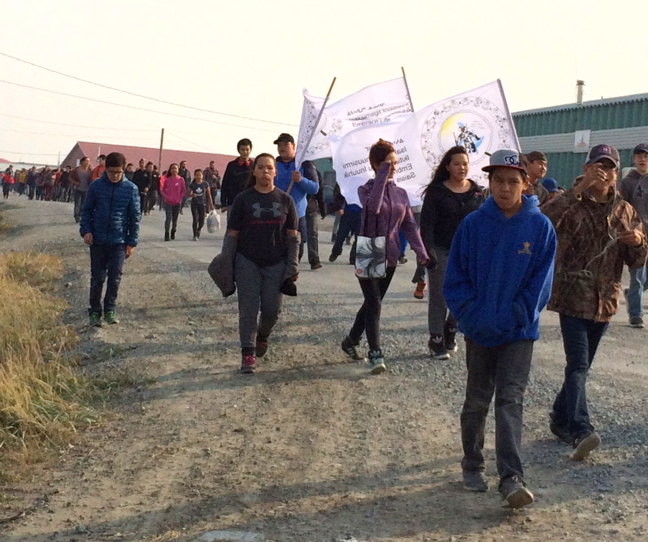 Students in Rankin Inlet participate in an Embrace Life Council walk Sept. 8. The walks, which have been duplicated around Nunavut this summer and fall, aim to bring people together who have been impacted by the loss of loved ones through suicide. According to the Nunavut coroner's office, Rankin Inlet, with a current population of about 2,800, lost 36 people to suicide between 1999 and 2016. (PHOTO BY AMANDA EECHERK)