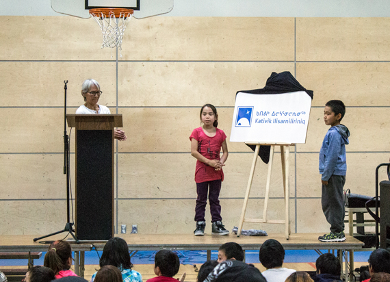 Alicie Nalukturuk, current chair of the Kativik School Board, left, helps unveil the board's new logo and name: Nunavimmi Ilisarniliriniq or the Nunavik School Board, Sept. 11 in Kuujjuaq. The school board’s council of commissioners are up for election next month. (FILE PHOTO)