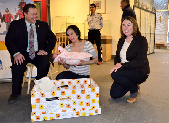 Emily Shoapik of Pangnirtung places her two-week-old newborn, Rachel Shoapik, into one of the Finnish-style baby boxes the Government of Nunavut’s Department of Health began distributing to parents of newborns across the territory last year as a way to encourage safe sleeping. (FILE PHOTO) 